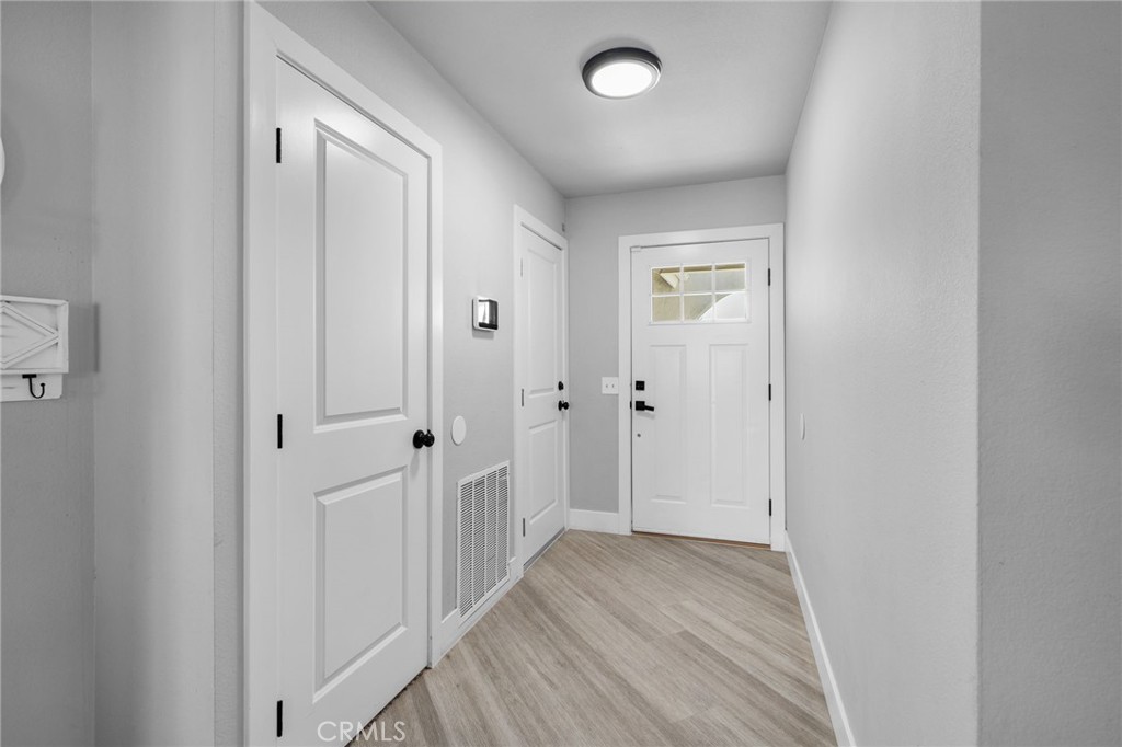 8949 Cudahy Court Riverside, CA 92503 - Photo 4 of 42 Interior Front Door/ Interior Garage Door and Closet