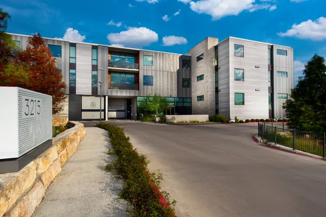 a view of a building with a street