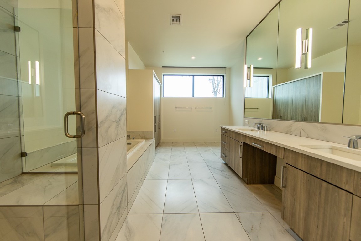 3215 Exposition Boulevard, Unit A21 Austin, TX 78703 - Photo 12 of 22 a bathroom with a sink a toilet and shower