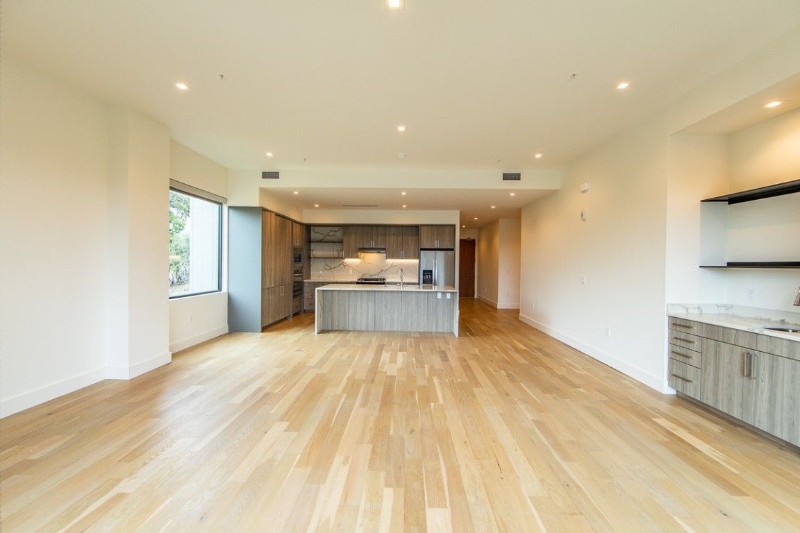 3215 Exposition Boulevard, Unit A21 Austin, TX 78703 - Photo 15 of 22 a view of a kitchen with a sink and a refrigerator