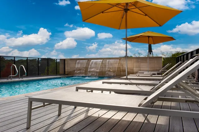 a view of a backyard with sitting area