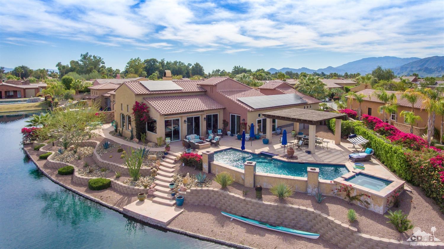 10 Via Santa Ramona Rancho Mirage, CA 92270 - Photo 18 of 78 a aerial view of a house with swimming pool and lake view