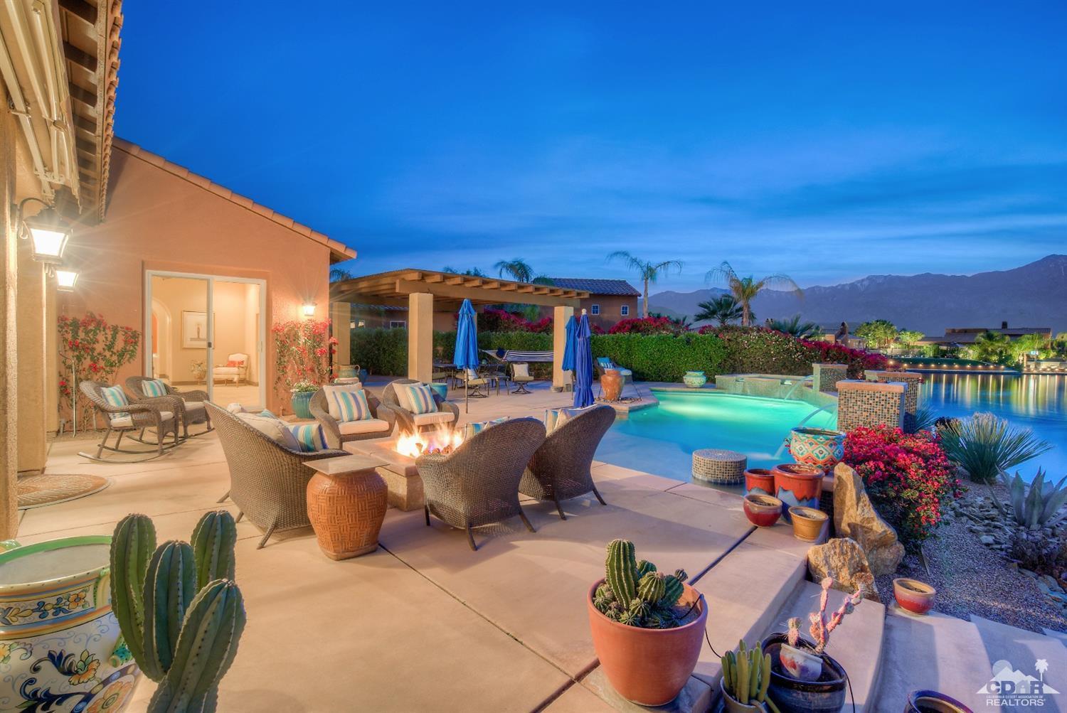 10 Via Santa Ramona Rancho Mirage, CA 92270 - Photo 2 of 78 a view of a patio with couches table and chairs and potted plants