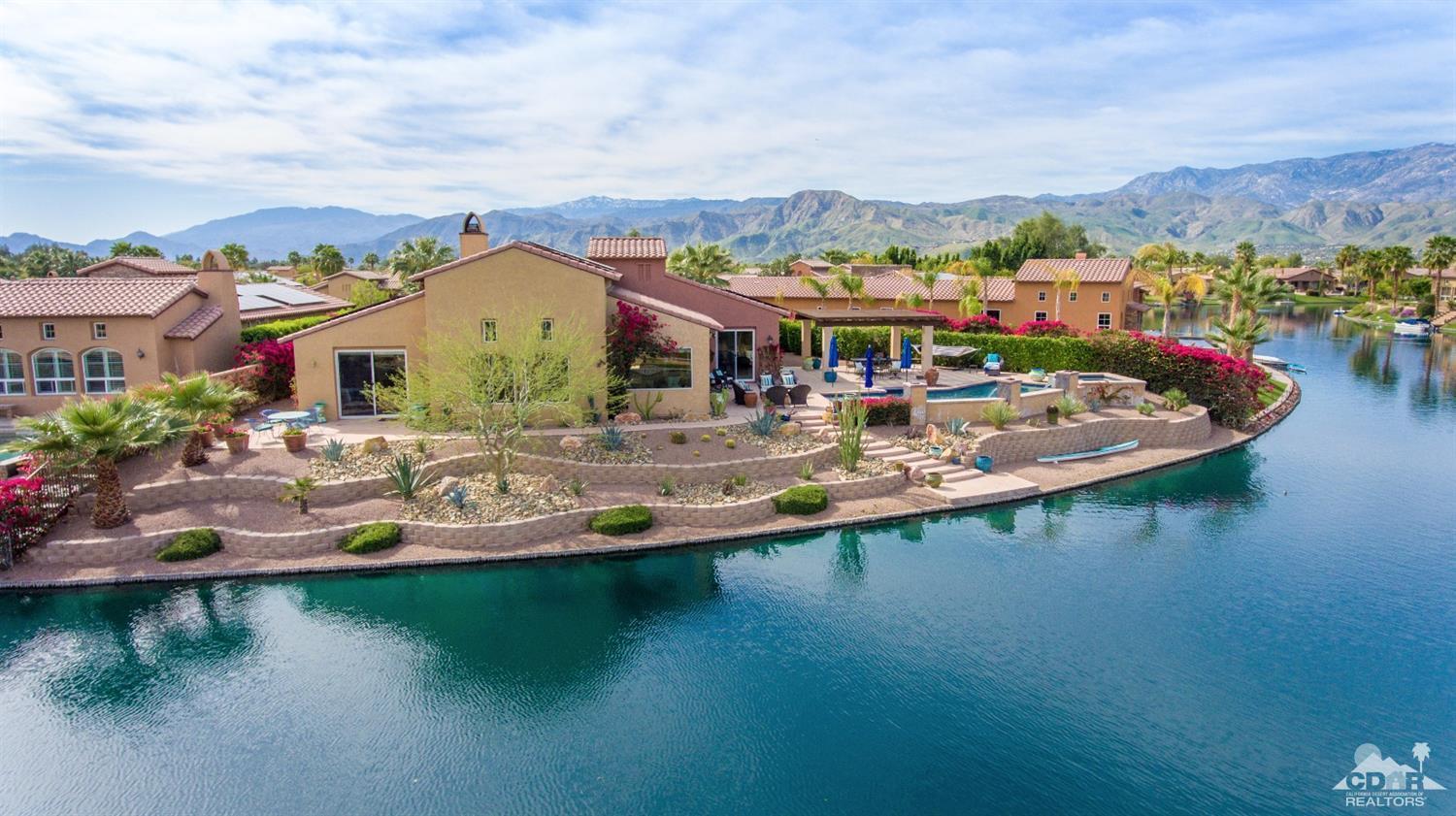 10 Via Santa Ramona Rancho Mirage, CA 92270 - Photo 23 of 78 an aerial view of a house with swimming pool and lake view