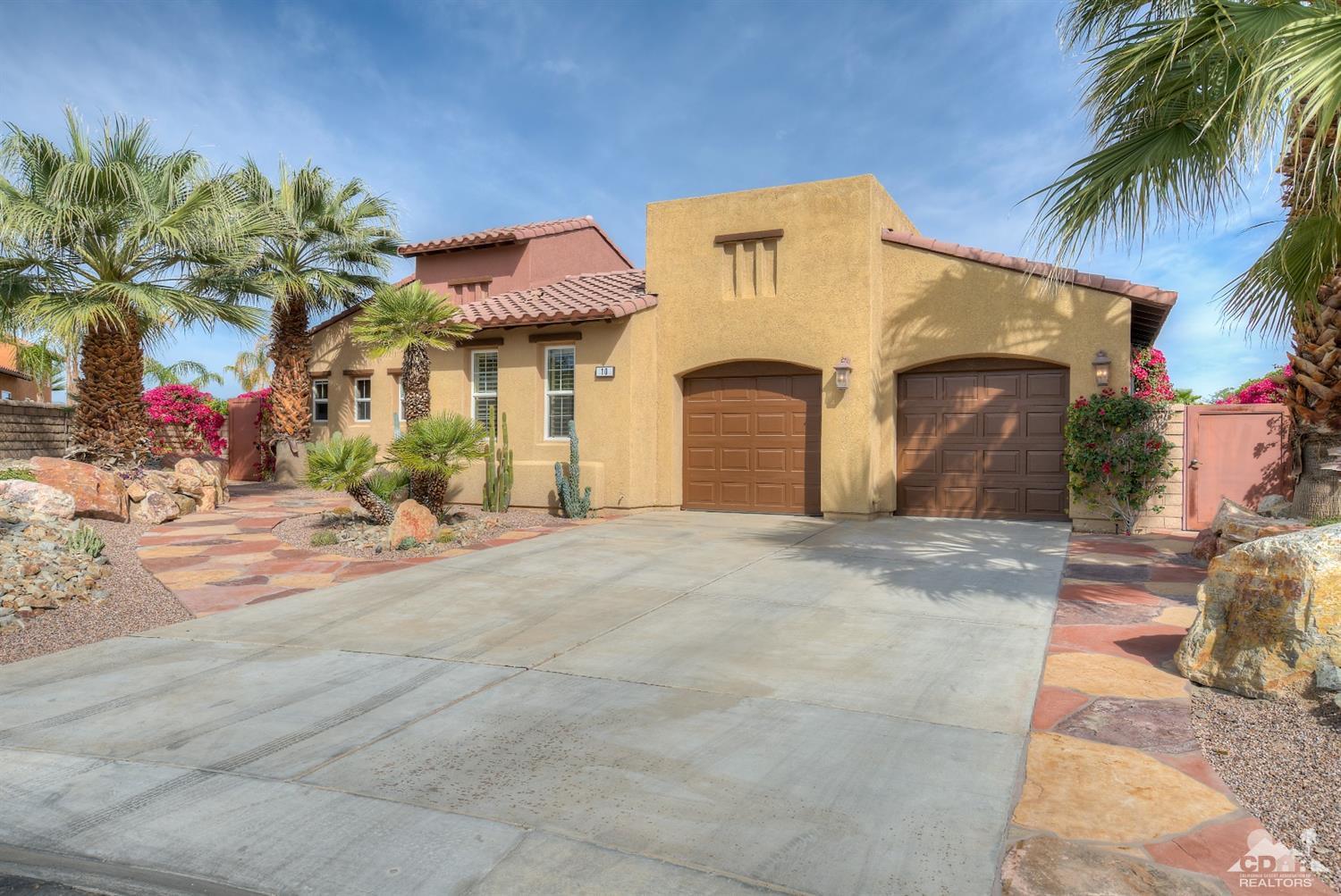 10 Via Santa Ramona Rancho Mirage, CA 92270 - Photo 27 of 78 a front view of a house with a yard and garage