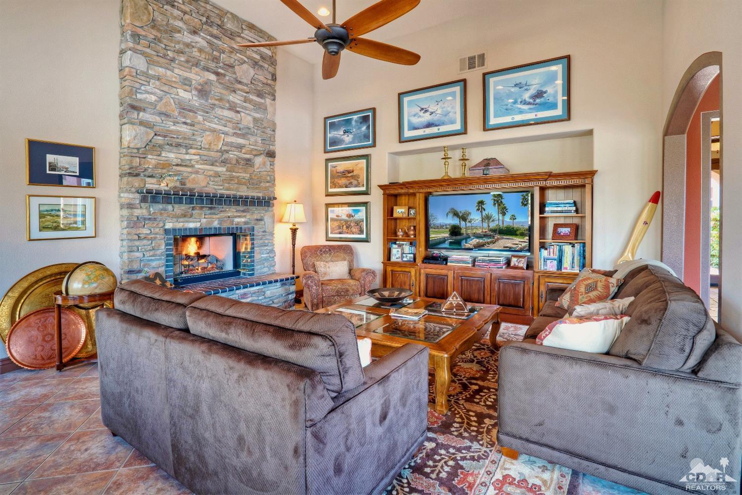 10 Via Santa Ramona Rancho Mirage, CA 92270 - Photo 41 of 78 a living room with furniture and a fireplace