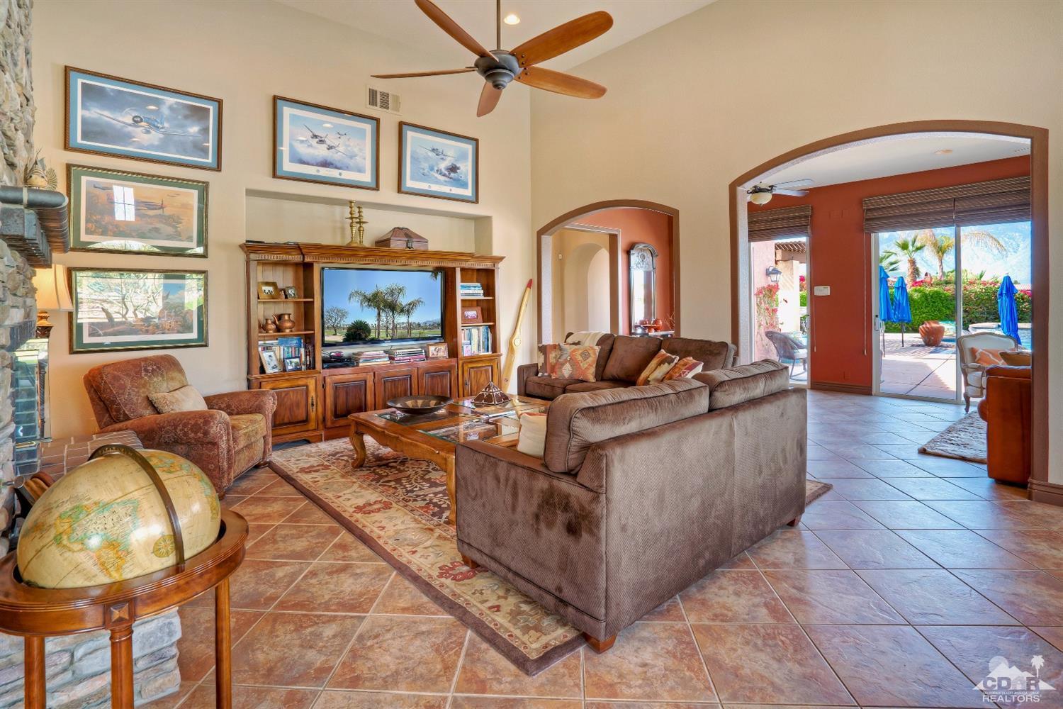 10 Via Santa Ramona Rancho Mirage, CA 92270 - Photo 42 of 78 a living room with furniture and a fireplace