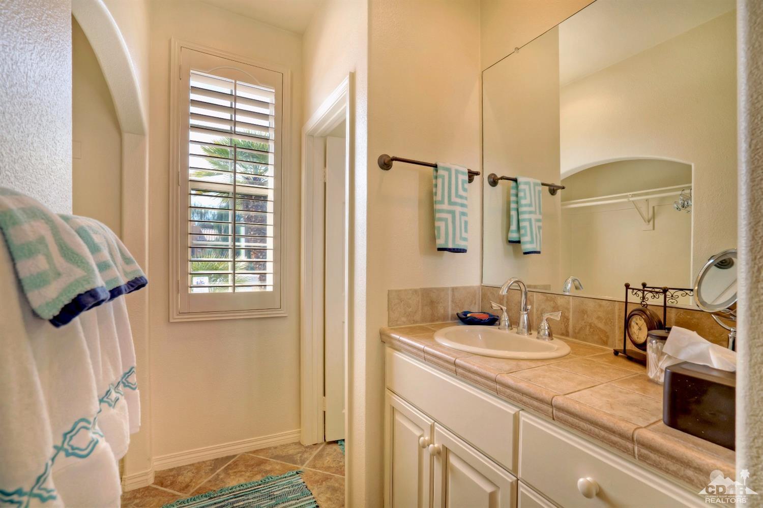 10 Via Santa Ramona Rancho Mirage, CA 92270 - Photo 64 of 78 a bathroom with a sink double vanity and a mirror