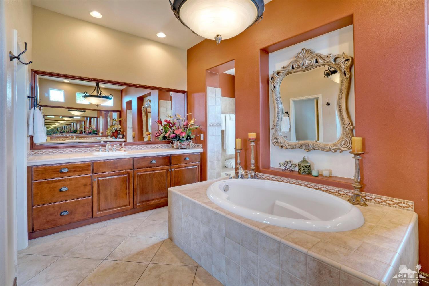 10 Via Santa Ramona Rancho Mirage, CA 92270 - Photo 71 of 78 a bathroom with a tub sink and mirror