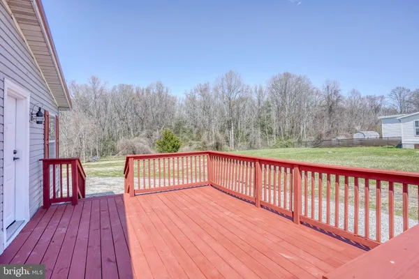 a view of deck with a yard