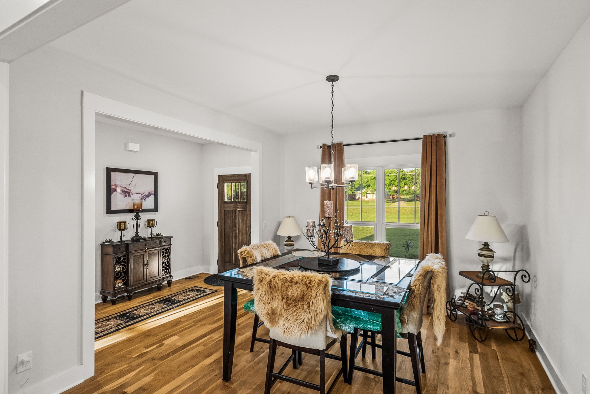 3378 New Hall Road Greenbrier, TN 37073 - Photo 19 of 83 a view of a dining room with furniture window and wooden floor