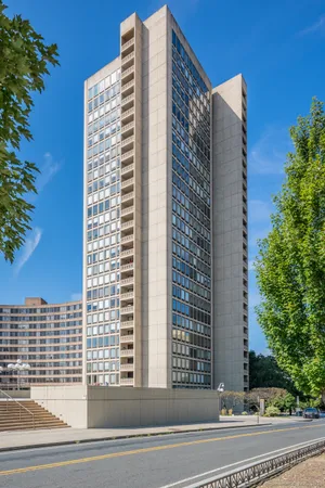 a view of a building and trees