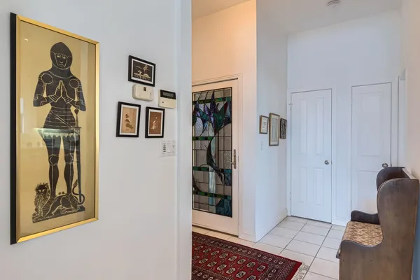 a view of a hallway with paintings on the wall