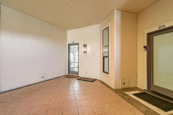 a view of a big room with windows