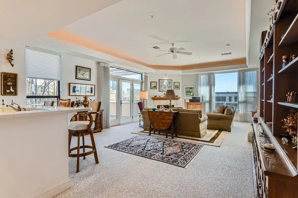 a living room with furniture rug and a flat screen tv