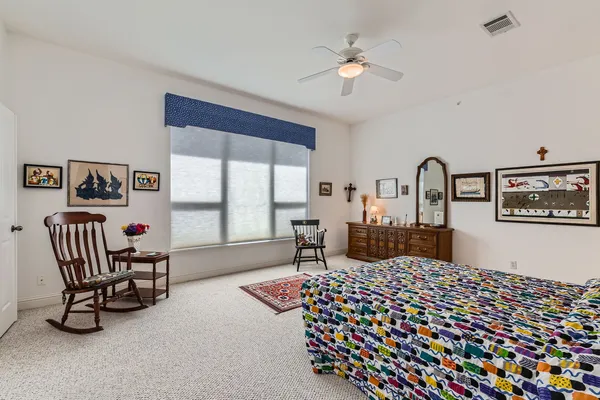 a bedroom with furniture and window