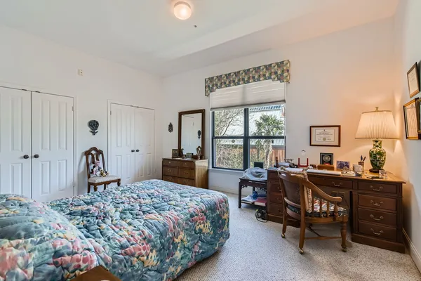 a bedroom with a bed and furniture