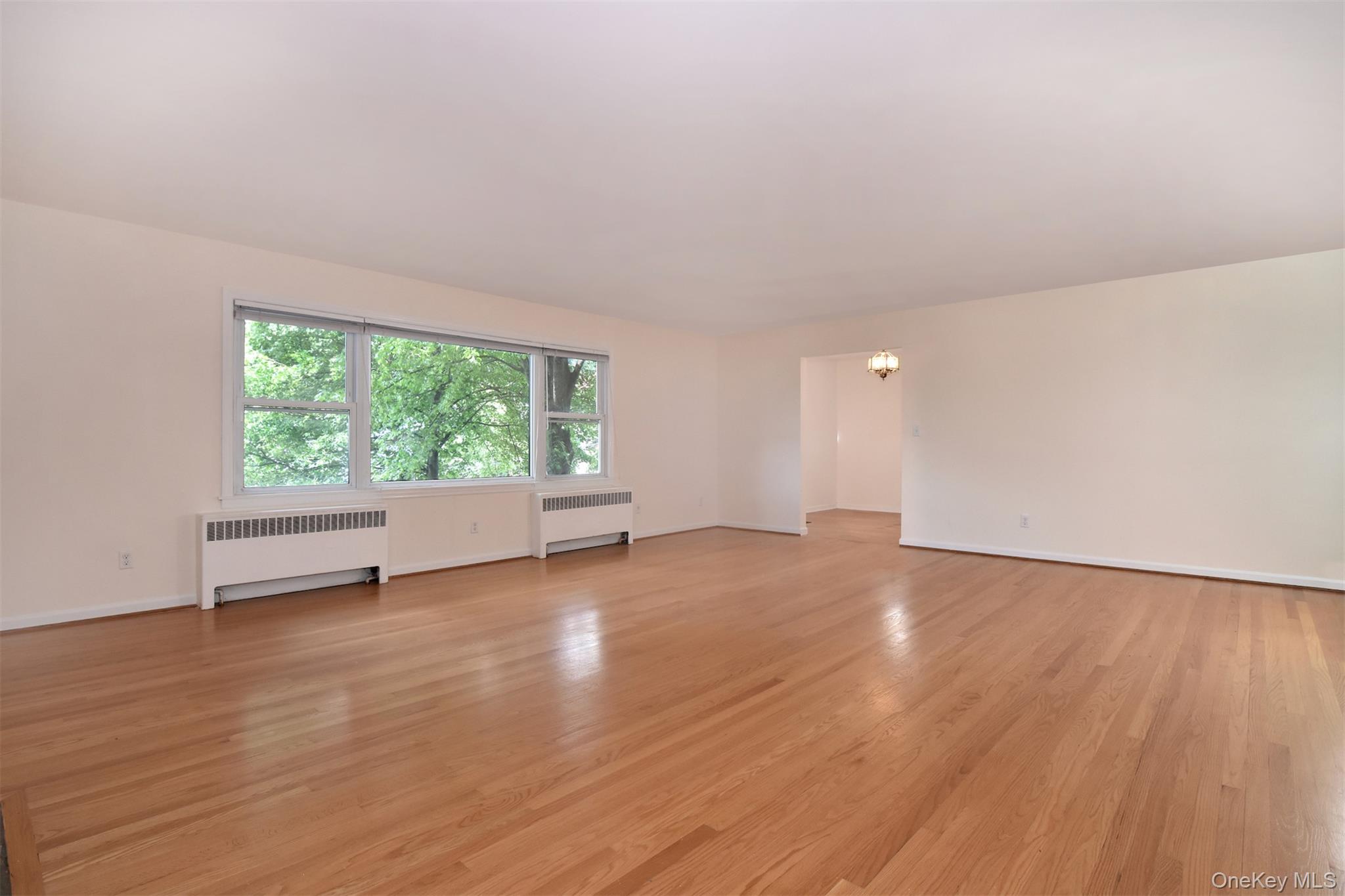 74 Briary Road Dobbs Ferry, NY 10522 - Photo 2 of 19 Spacious LR with west-facing picture window.