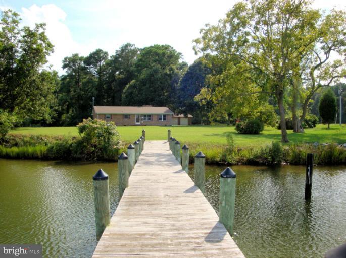 16236 Pine Tree Lane Ridge, MD 20680 - Photo 4 of 30 a view of a lake with a large trees