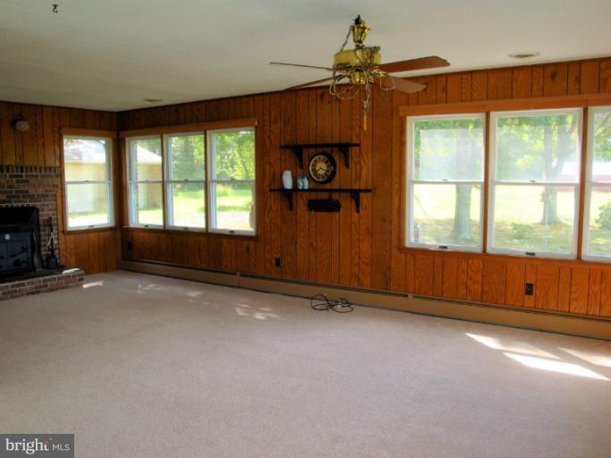 16236 Pine Tree Lane Ridge, MD 20680 - Photo 9 of 30 an empty room with windows