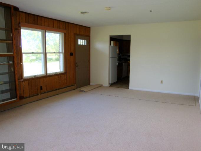 16236 Pine Tree Lane Ridge, MD 20680 - Photo 10 of 30 an empty room with windows