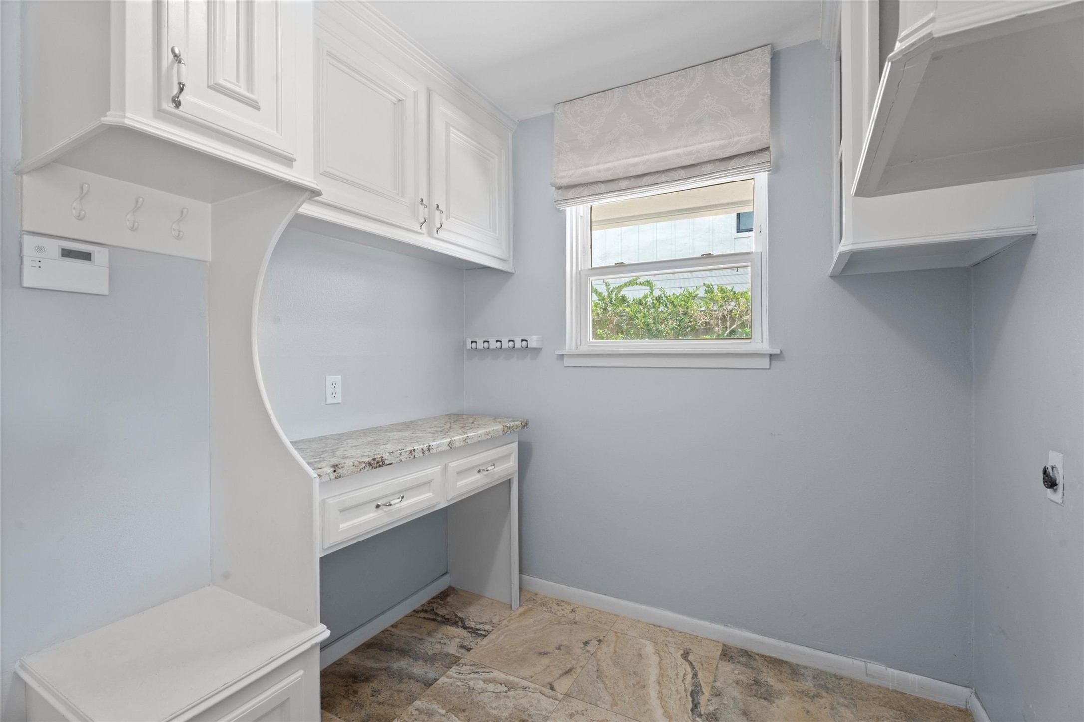 1328 Bingle Road Houston, TX 77055 - Photo 21 of 48 Convenient laundry and mudroom combination complete with built-n desk, storage and utility hooks.