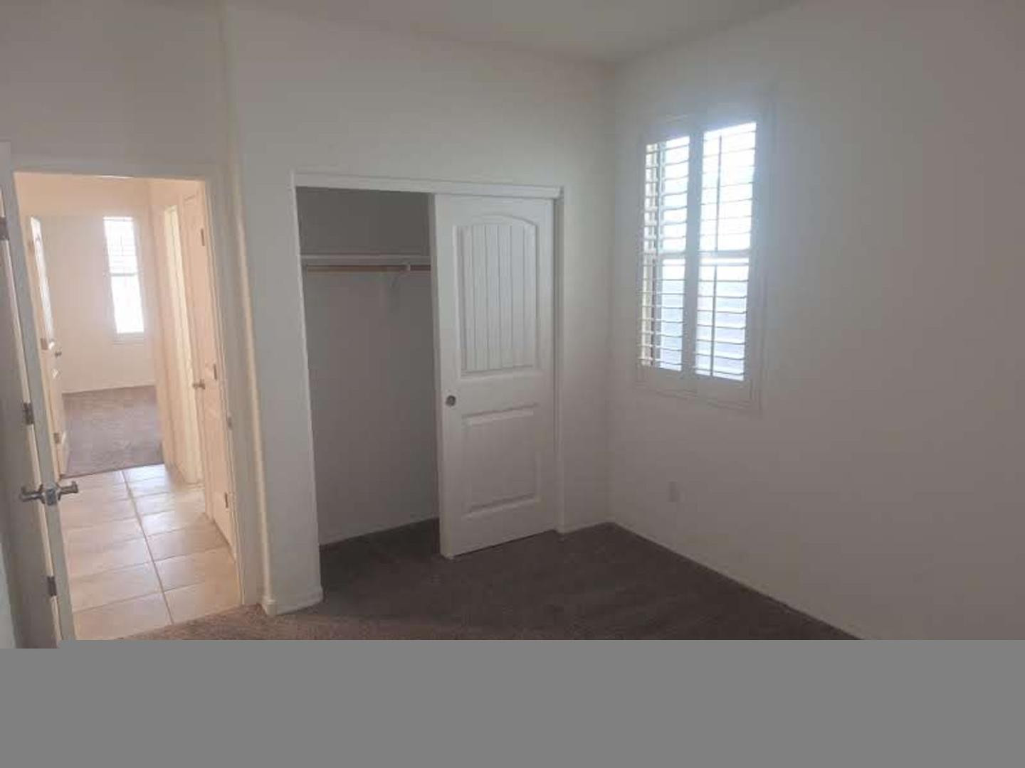 18541 West Mescal Street Surprise, AZ 85388 - Photo 27 of 31 an empty room with windows