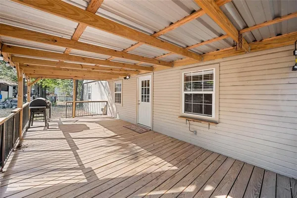 a view of a balcony with wooden floor