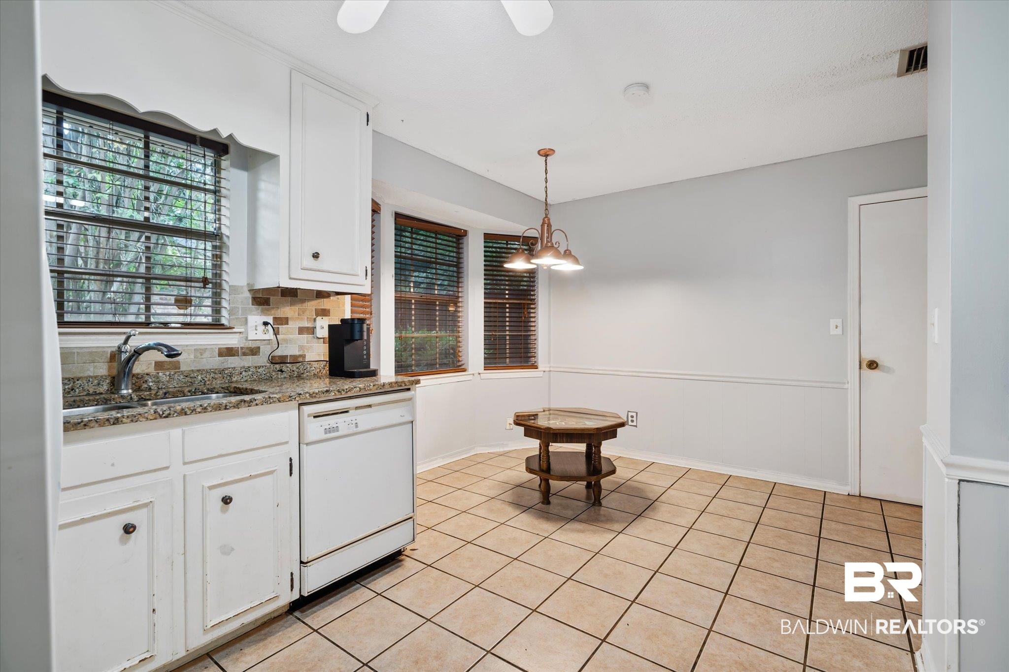 6657 Hounds Run South Mobile, AL 36608 - Photo 6 of 20 Kitchen featuring pendant lighting, white cabinetry, plenty of natural light, and white dishwasher