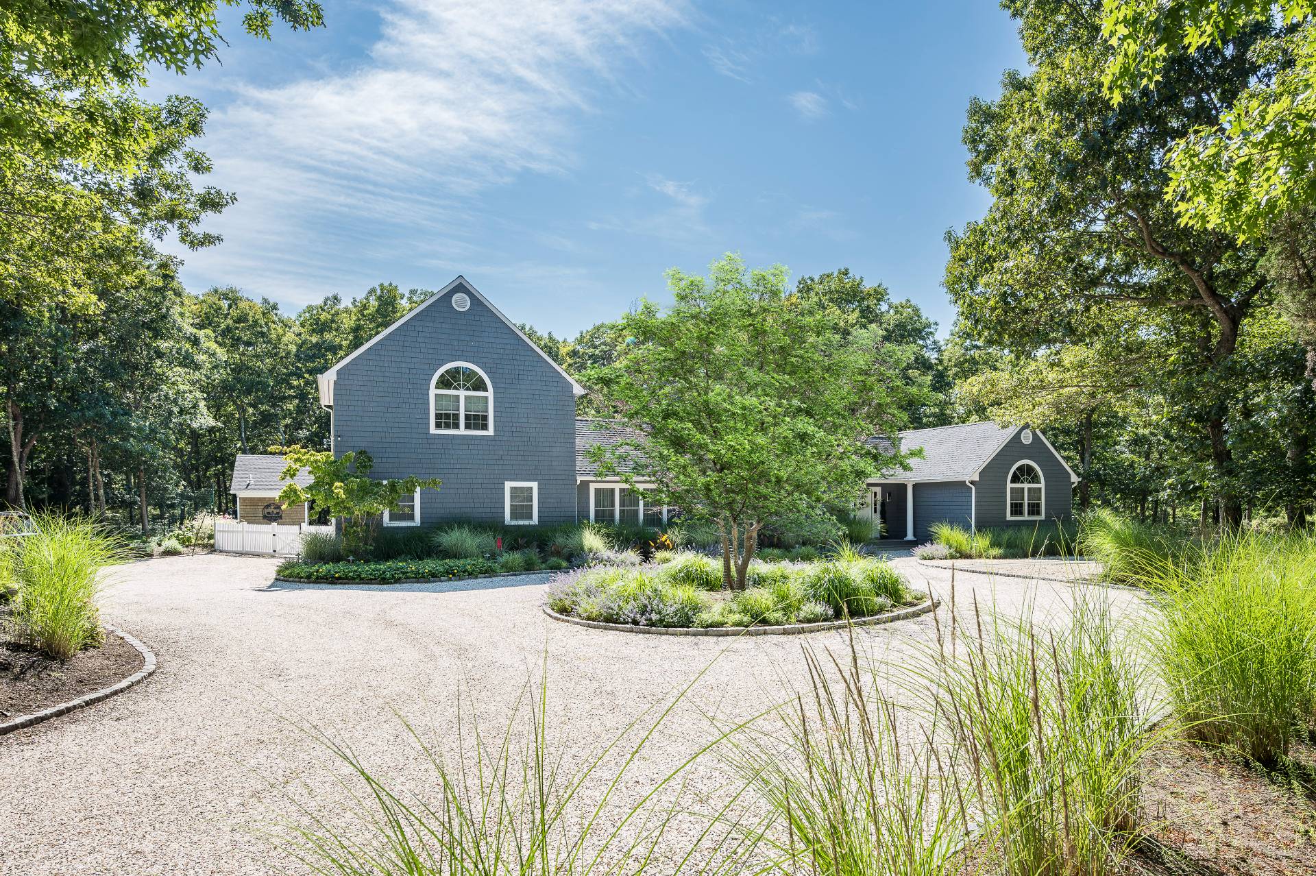 14 High Ridge Road East Hampton, NY 11937 - Photo 14 of 43 a front view of a house with a yard and an outdoor seating