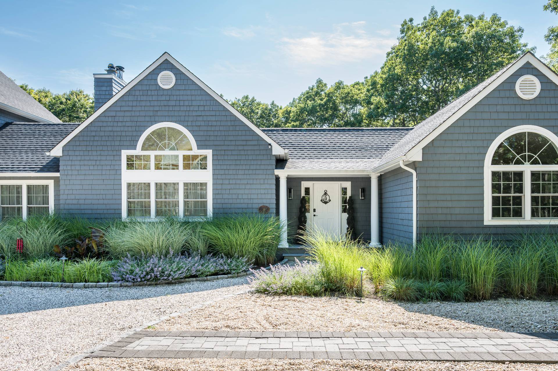 14 High Ridge Road East Hampton, NY 11937 - Photo 17 of 43 a front view of a house with a yard