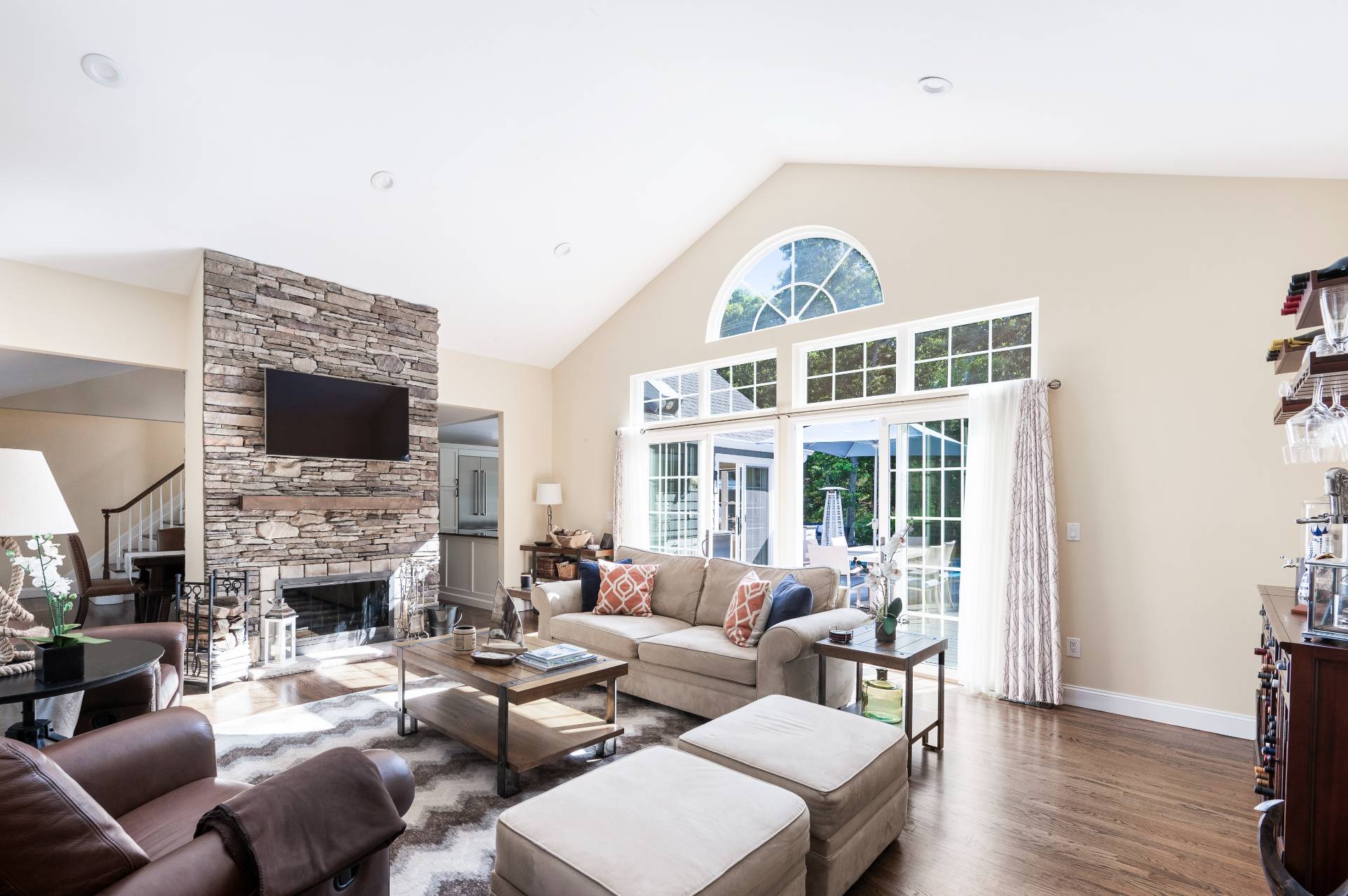 14 High Ridge Road East Hampton, NY 11937 - Photo 19 of 43 a living room with furniture a fireplace and a flat screen tv