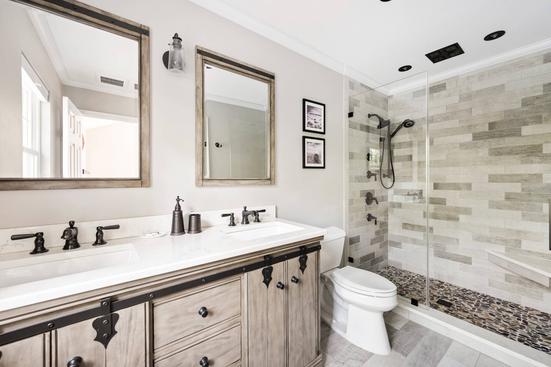 14 High Ridge Road East Hampton, NY 11937 - Photo 30 of 43 a bathroom with a sink a toilet a mirror and shower