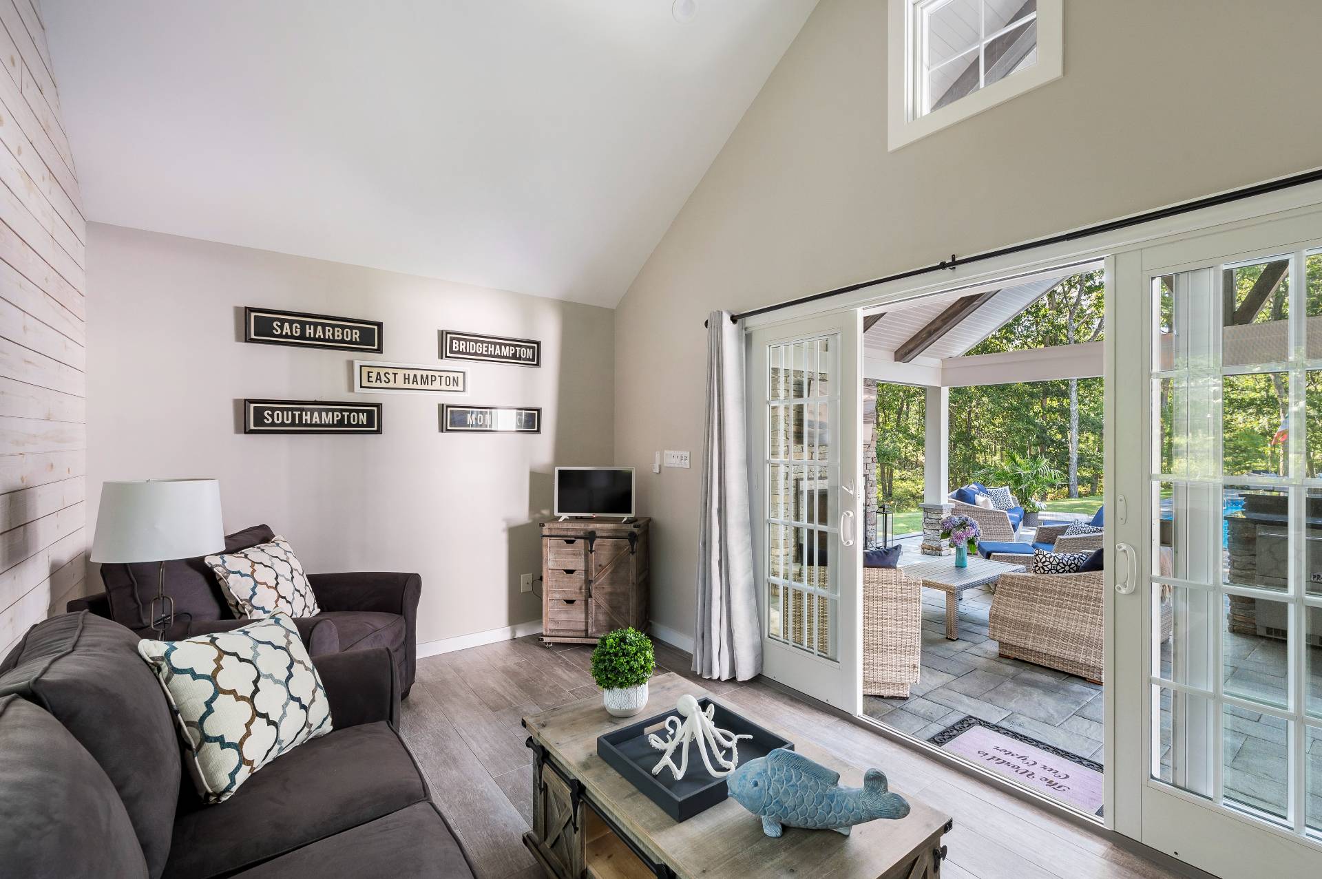 14 High Ridge Road East Hampton, NY 11937 - Photo 35 of 43 a living room with furniture and a floor to ceiling window