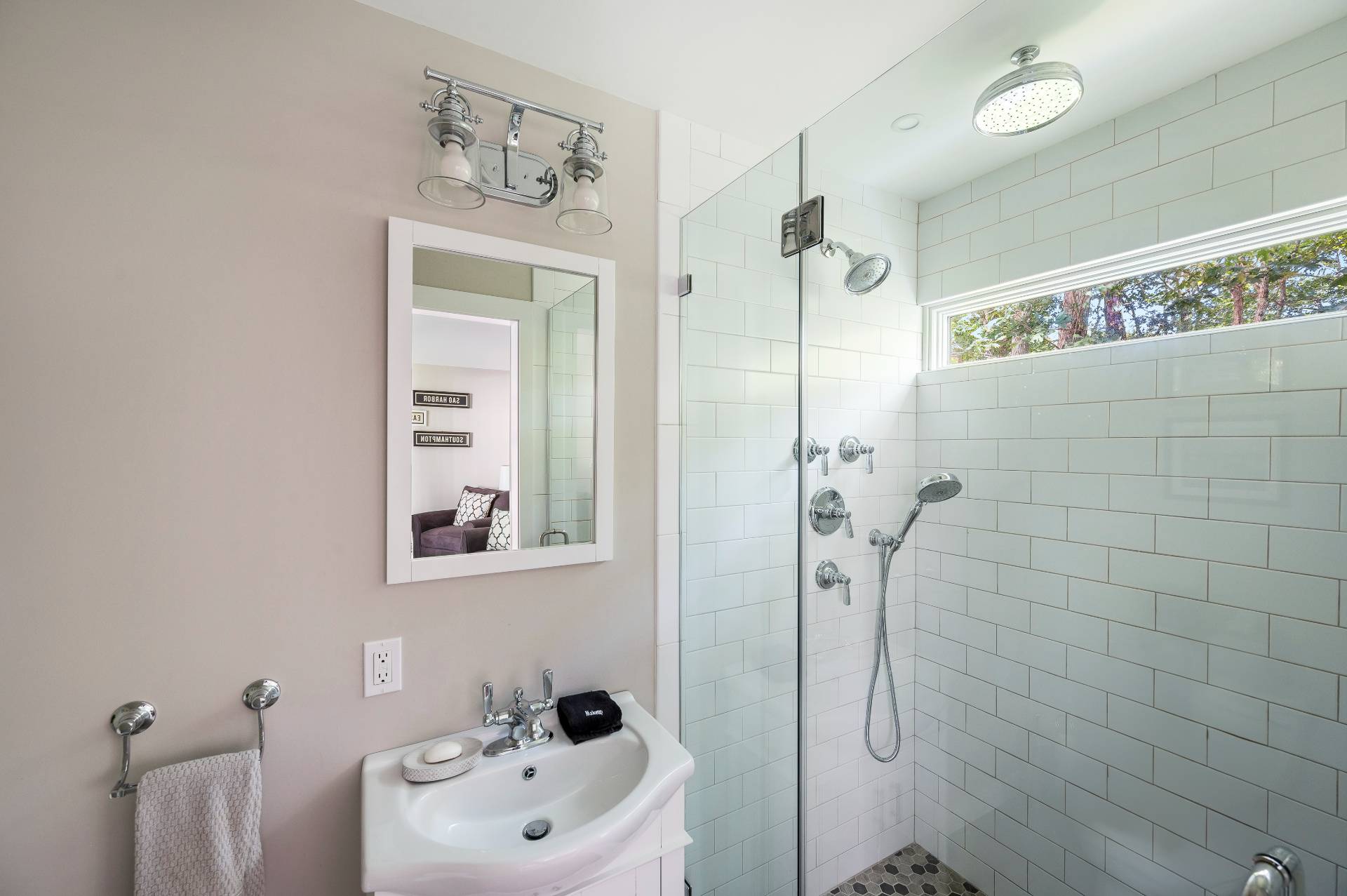 14 High Ridge Road East Hampton, NY 11937 - Photo 36 of 43 a bathroom with a shower sink and mirror