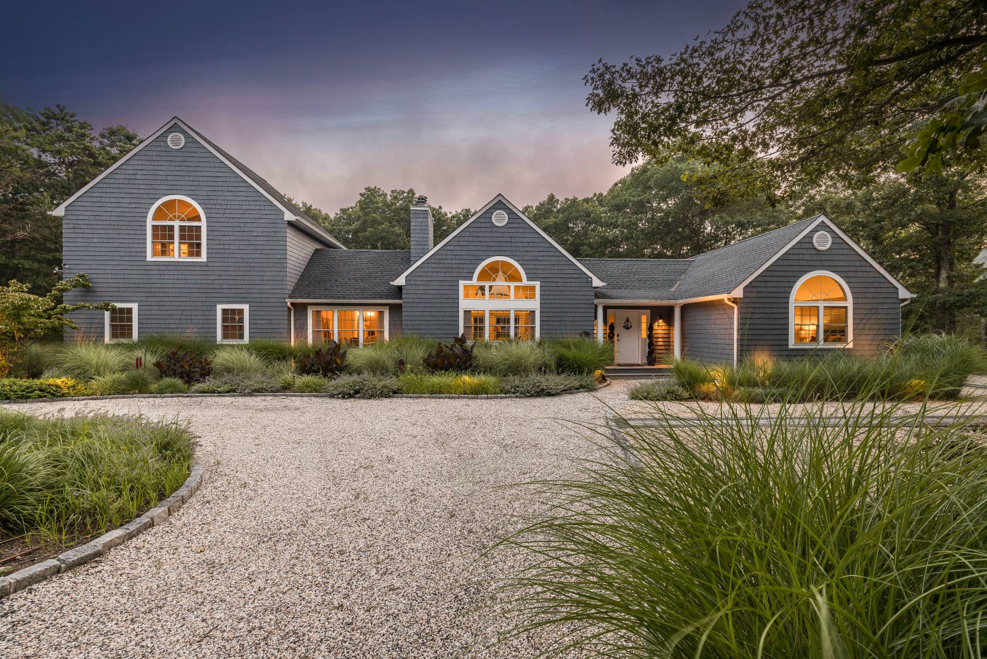 14 High Ridge Road East Hampton, NY 11937 - Photo 37 of 43 a front view of a house with a yard and garage