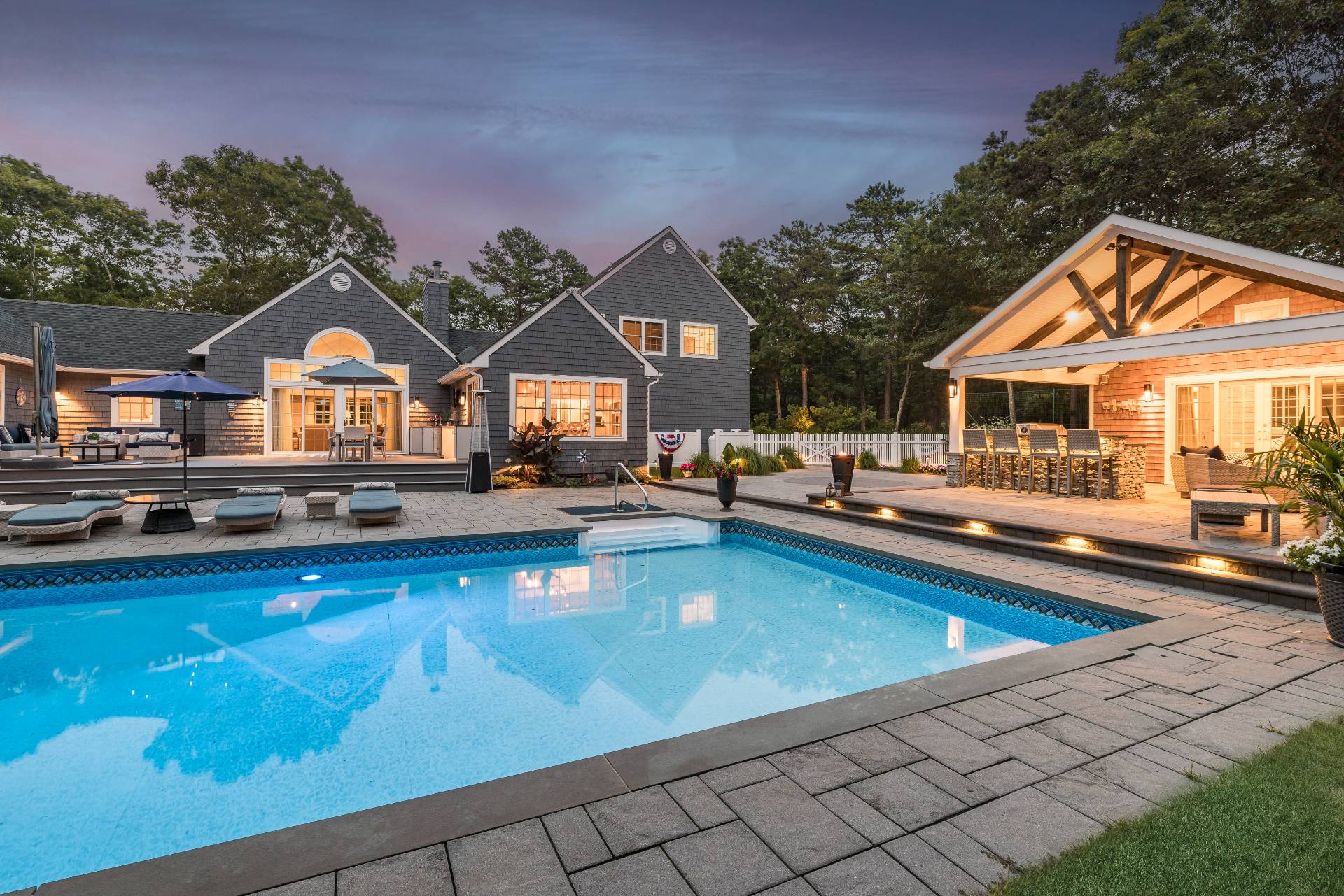 14 High Ridge Road East Hampton, NY 11937 - Photo 5 of 43 a swimming pool view with a seating space and a garden view