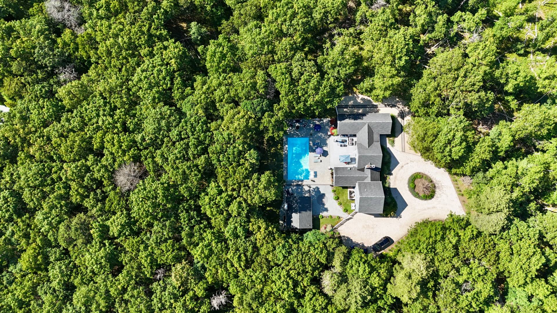 14 High Ridge Road East Hampton, NY 11937 - Photo 7 of 43 an aerial view of a house with a yard and large trees