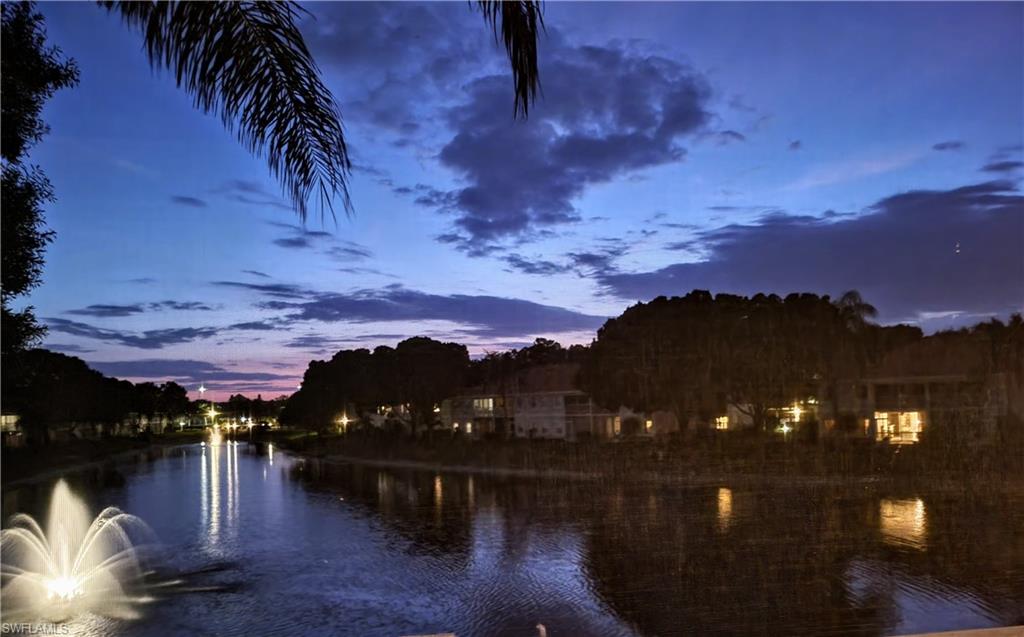 7435 Plumbago Bridge Road, Unit K201 Naples, FL 34109 - Photo 11 of 17 a view of a lake in front of the house