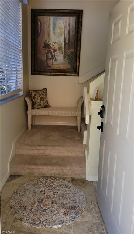 7435 Plumbago Bridge Road, Unit K201 Naples, FL 34109 - Photo 3 of 17 a view of a hallway