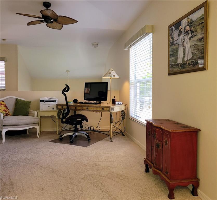 7435 Plumbago Bridge Road, Unit K201 Naples, FL 34109 - Photo 8 of 17 a view of a workspace with furniture and a window