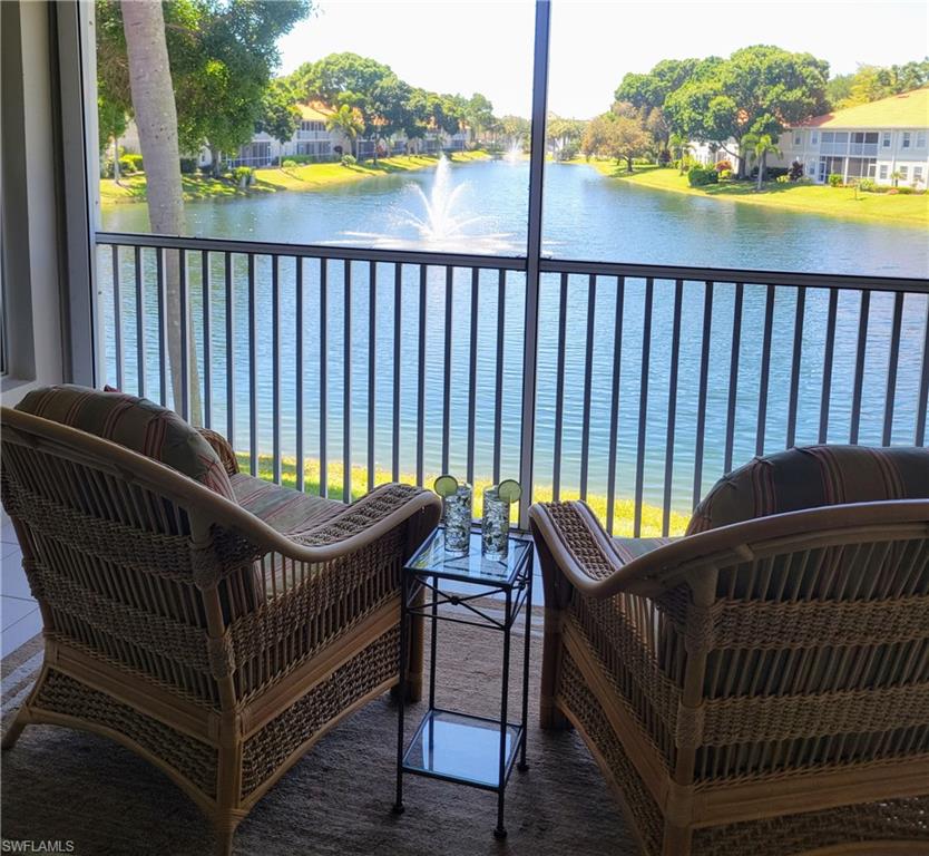 7435 Plumbago Bridge Road, Unit K201 Naples, FL 34109 - Photo 10 of 17 a balcony with view of outdoor space
