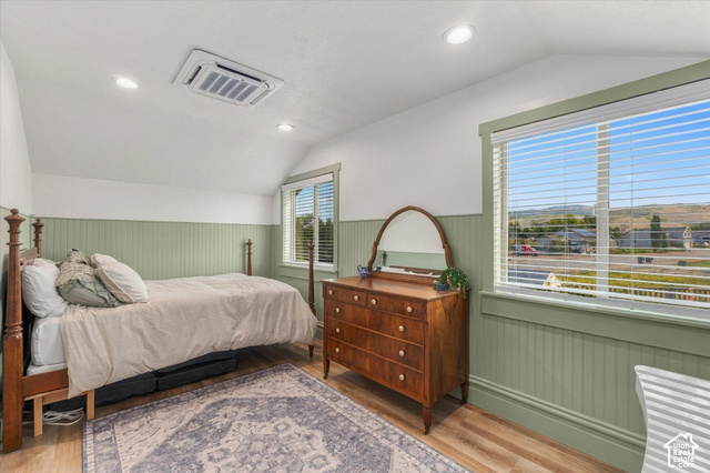 437 Scenic Heights Road Kamas, UT 84036 - Photo 25 of 46 Sloped ceiling room featuring wood-finish flooring, two windows with blinds, recessed lighting, and beadboard wall paneling