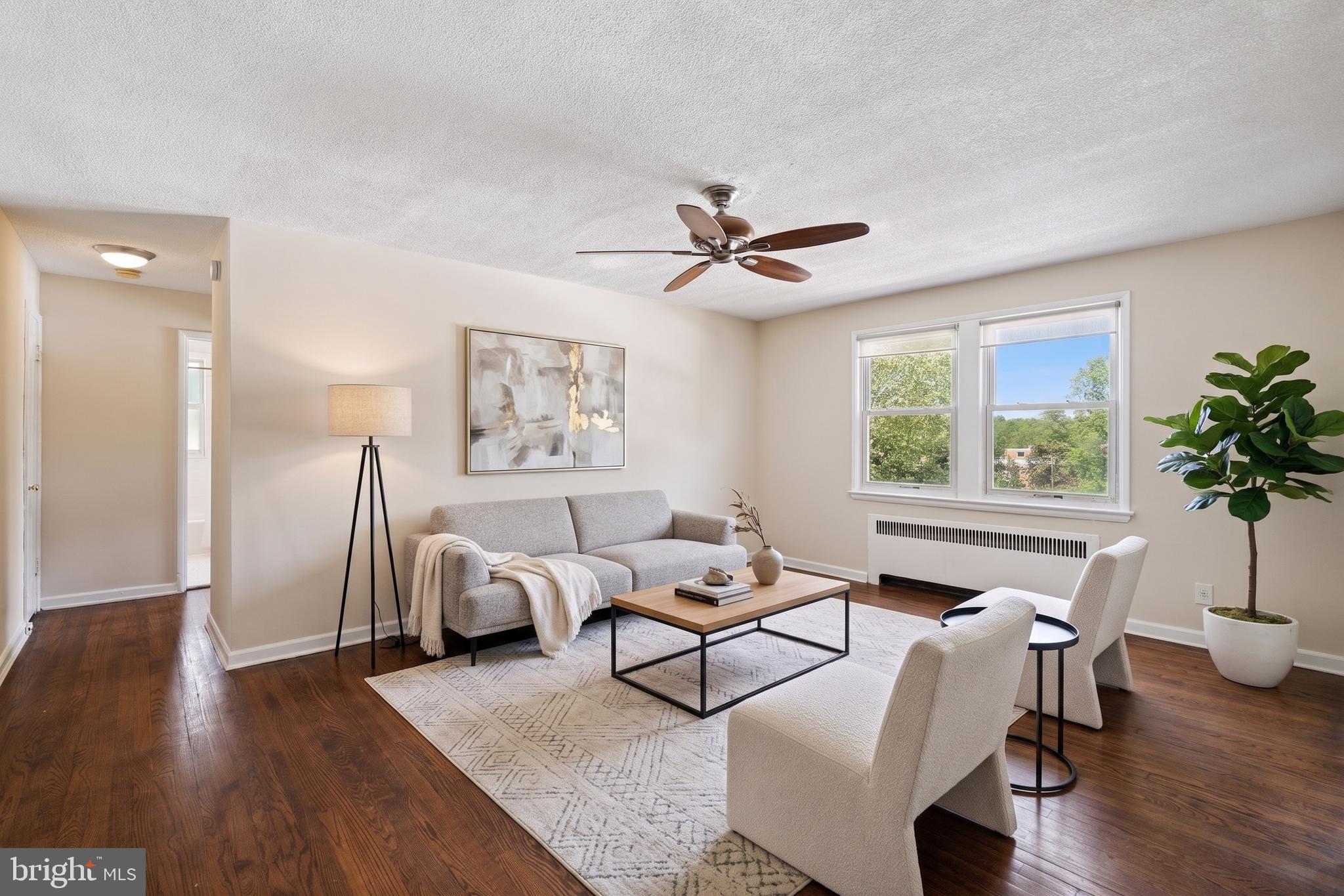 4029 Benton Street Northwest, Unit 302 Washington, DC 20007 - Photo 1 of 27 a living room with furniture and a window