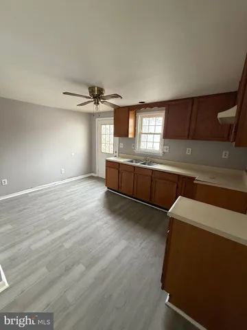a view of a kitchen with a sink