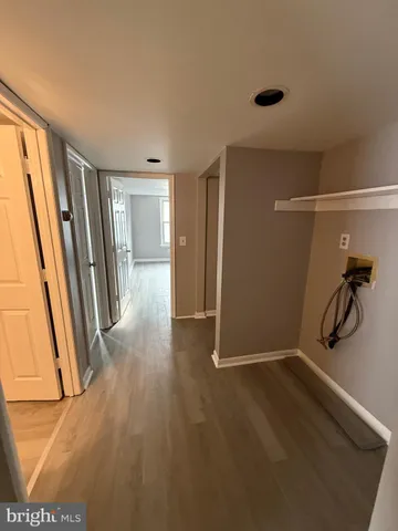 a view of a room with wooden floor and a carpet