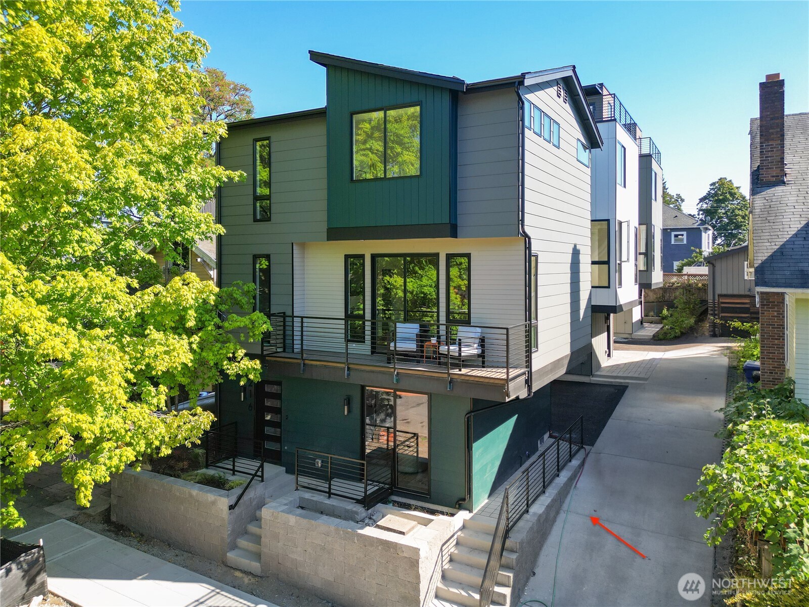 220 21st Avenue East Seattle, WA 98112 - Photo 1 of 38 a front view of a house with outdoor seating and plants