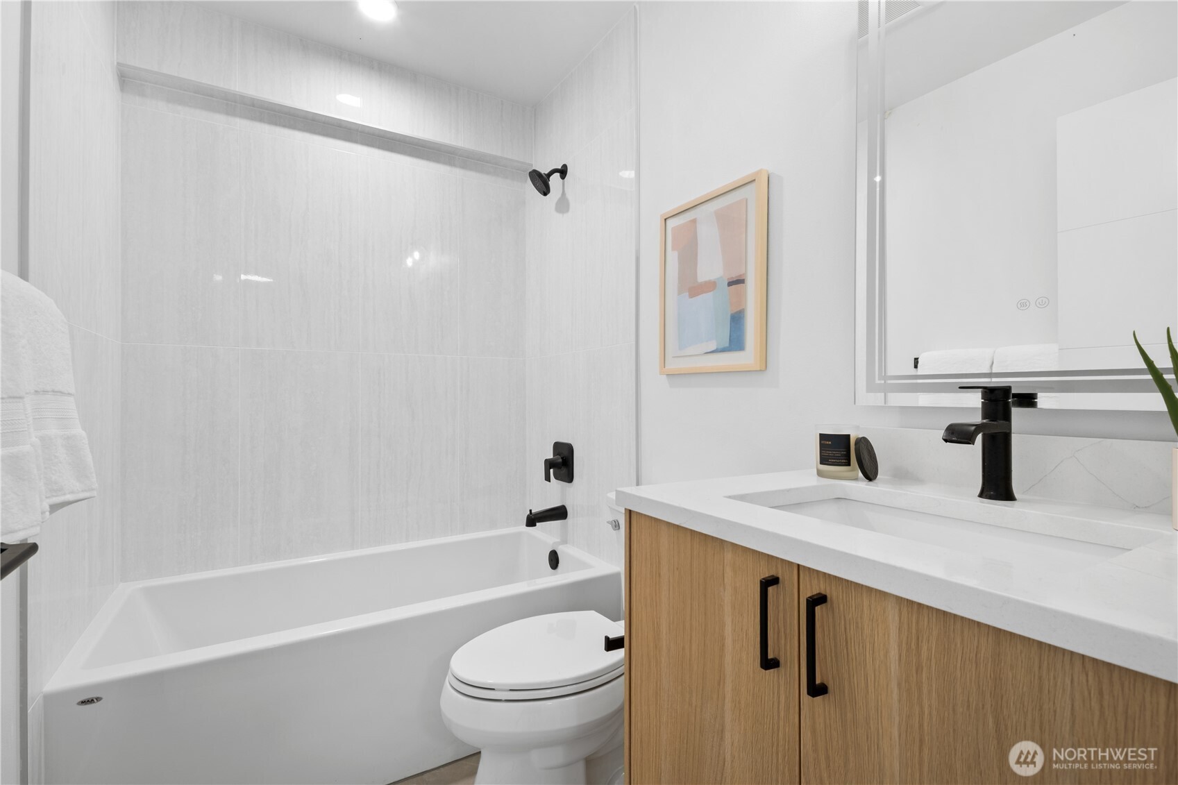 220 21st Avenue East Seattle, WA 98112 - Photo 11 of 38 a bathroom with a sink a toilet and a bathtub