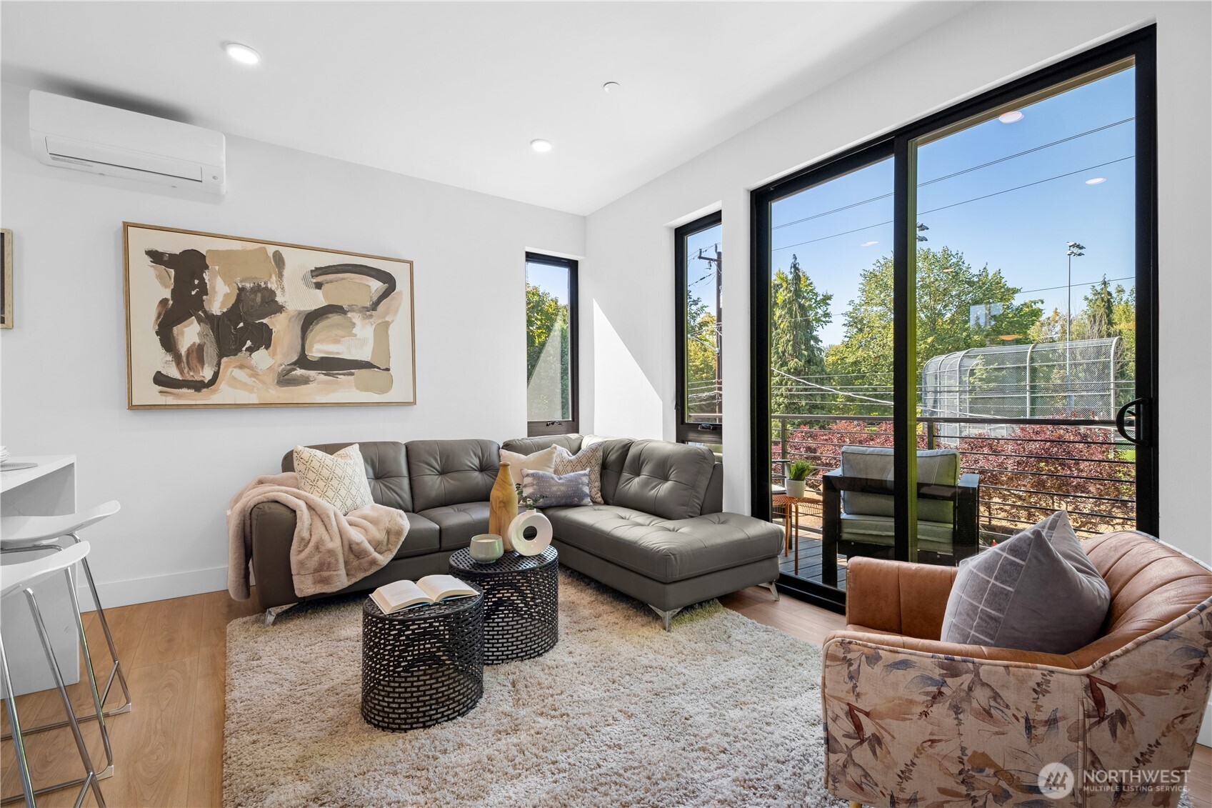 220 21st Avenue East Seattle, WA 98112 - Photo 13 of 38 a living room with furniture and a large window