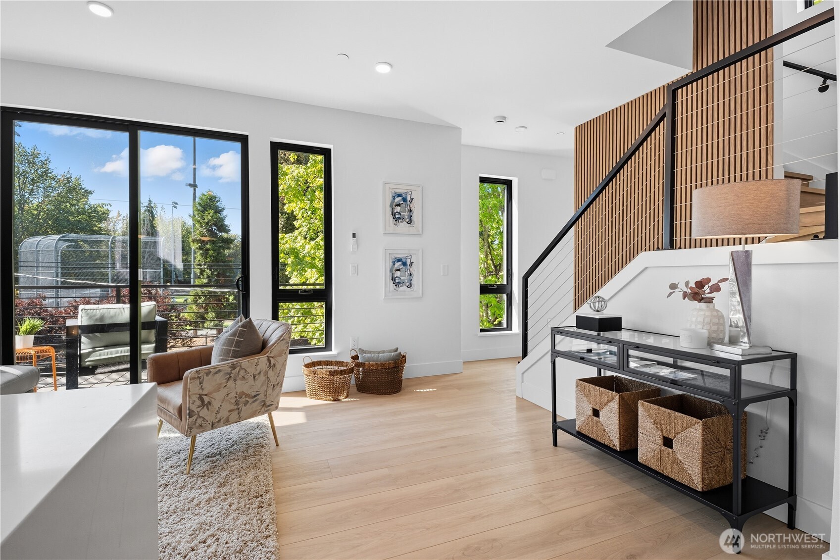 220 21st Avenue East Seattle, WA 98112 - Photo 15 of 38 a living room with furniture and a floor to ceiling window